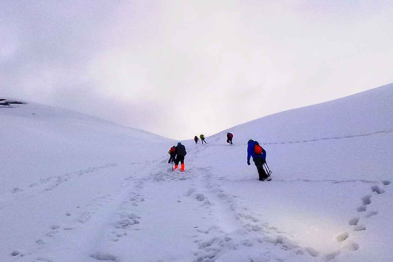 Climbing up to summit friendship peak
